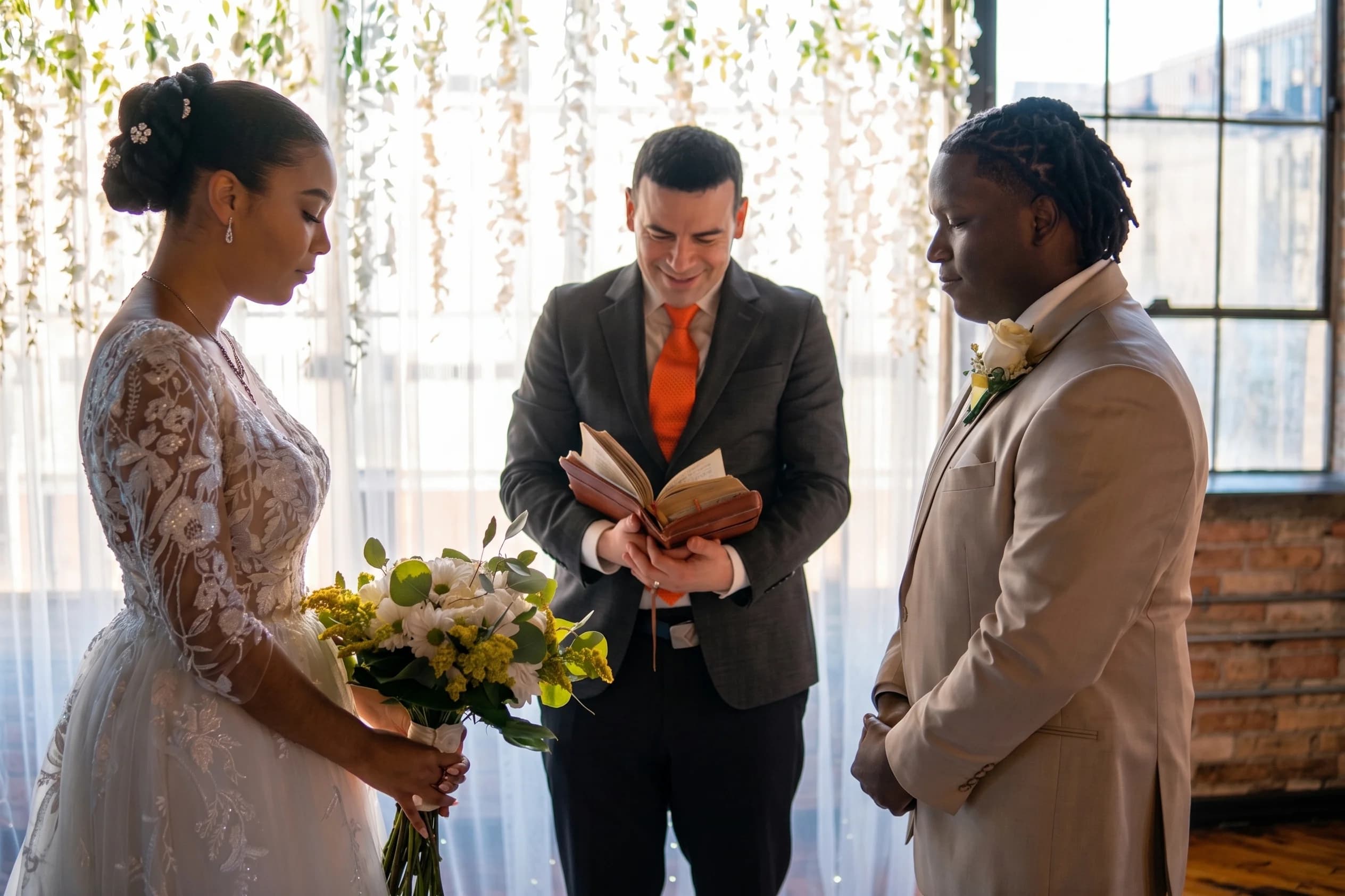 Wide 35mm view: Sydney & Malvin exchanging vows