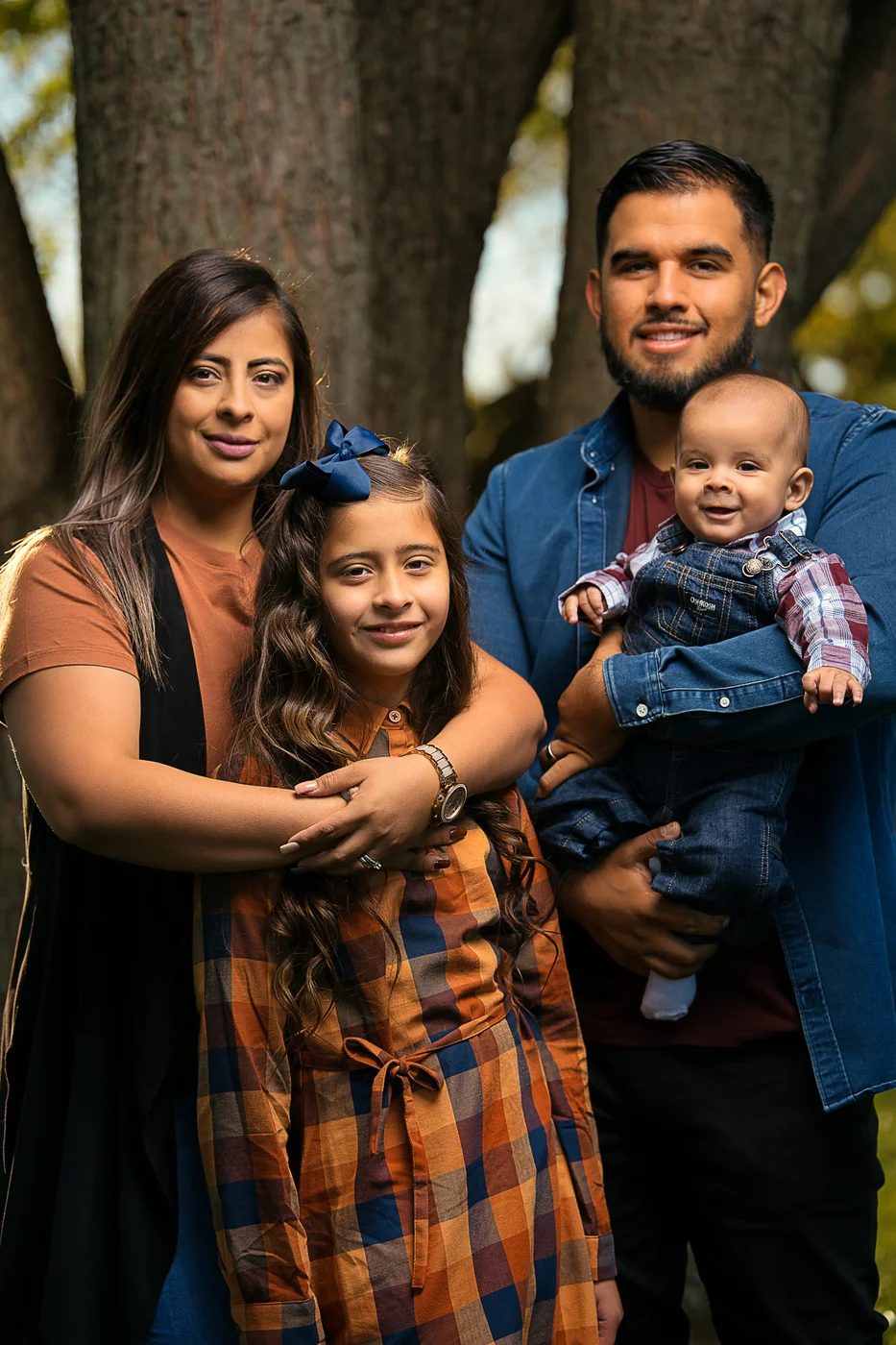 The Garcia family by the water on an autumn morning