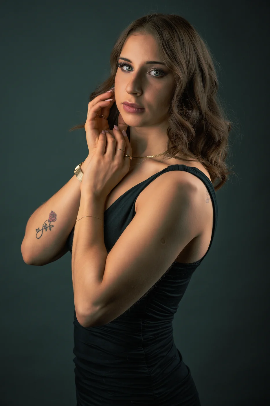 Karolina — studio portrait against a deep teal backdrop