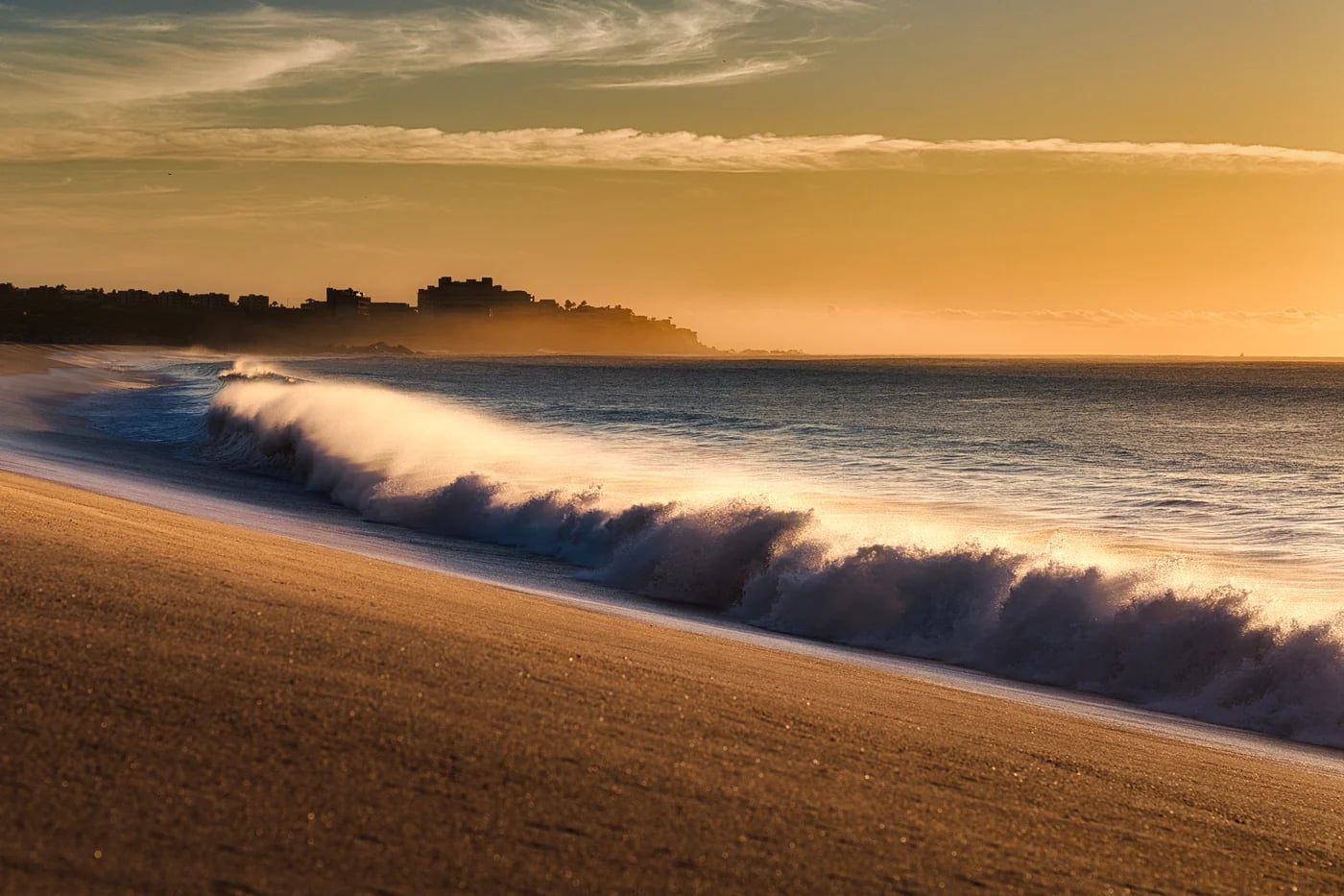A wave breaking at sunrise