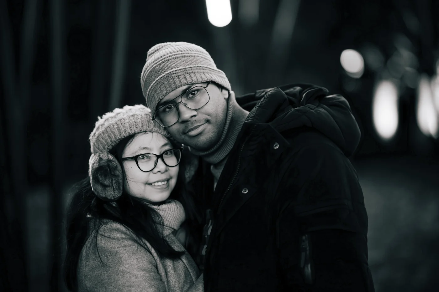 Rochelle and Joshua in winter hats, black and white