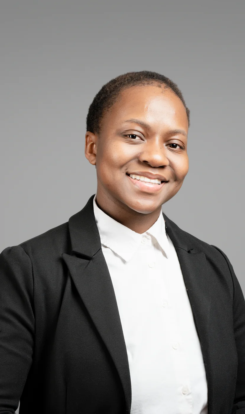 Corporate headshot on a grey background