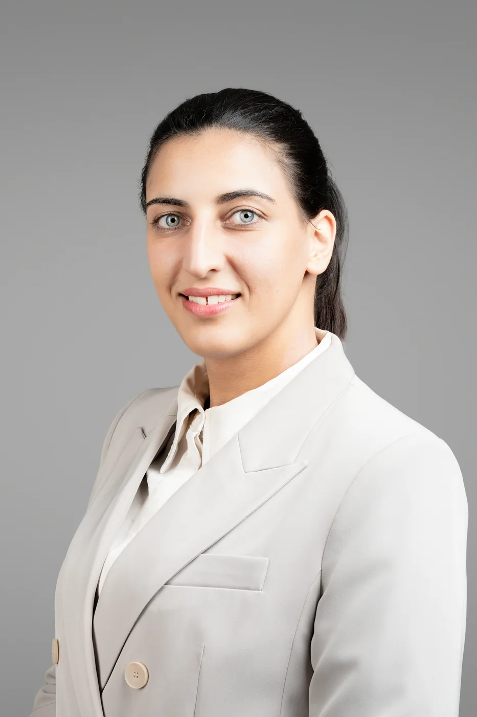 Corporate headshot on a grey background
