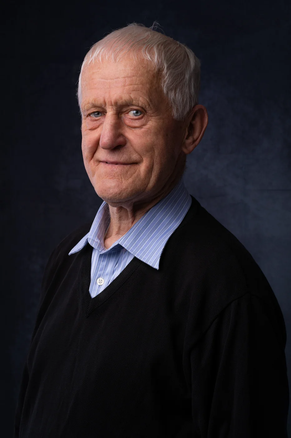 Studio portrait on a dark backdrop