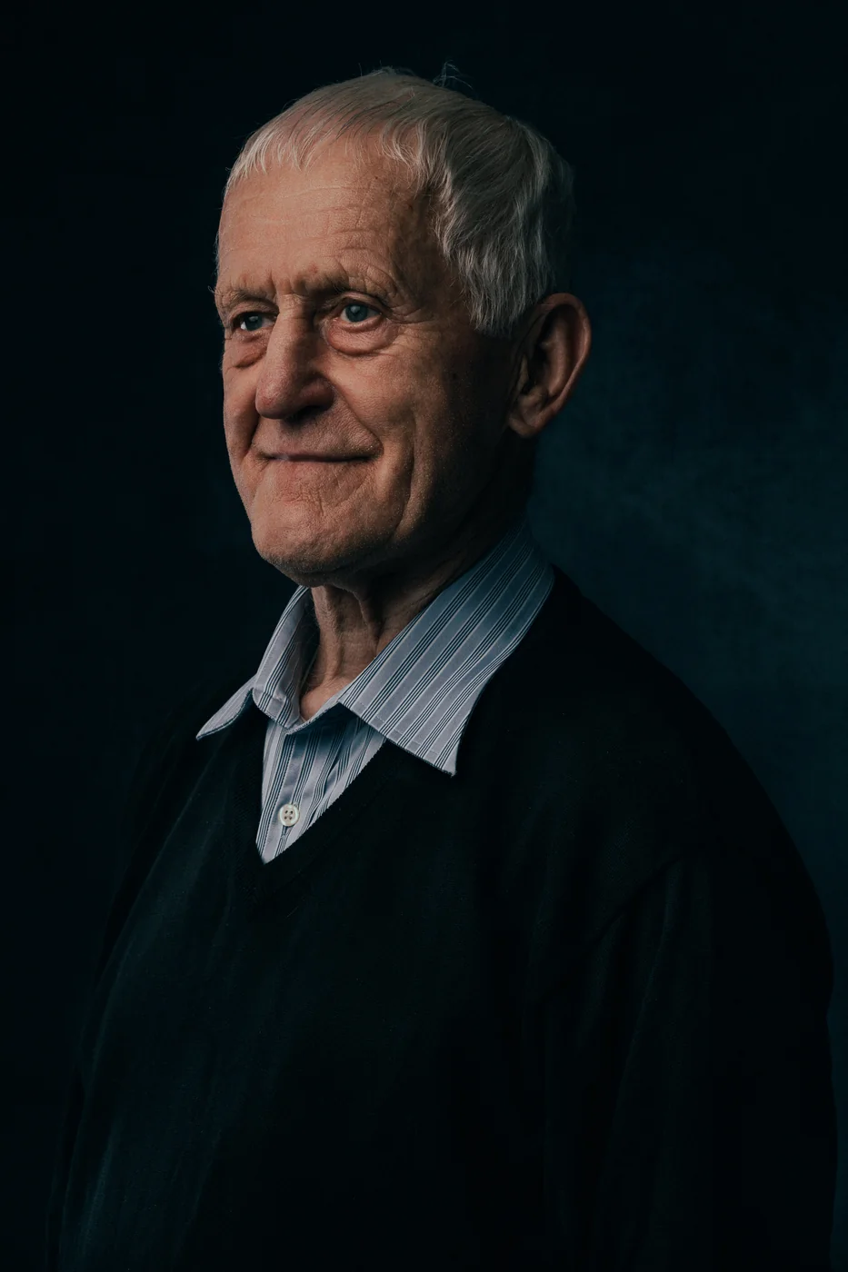 Studio portrait on a dark backdrop